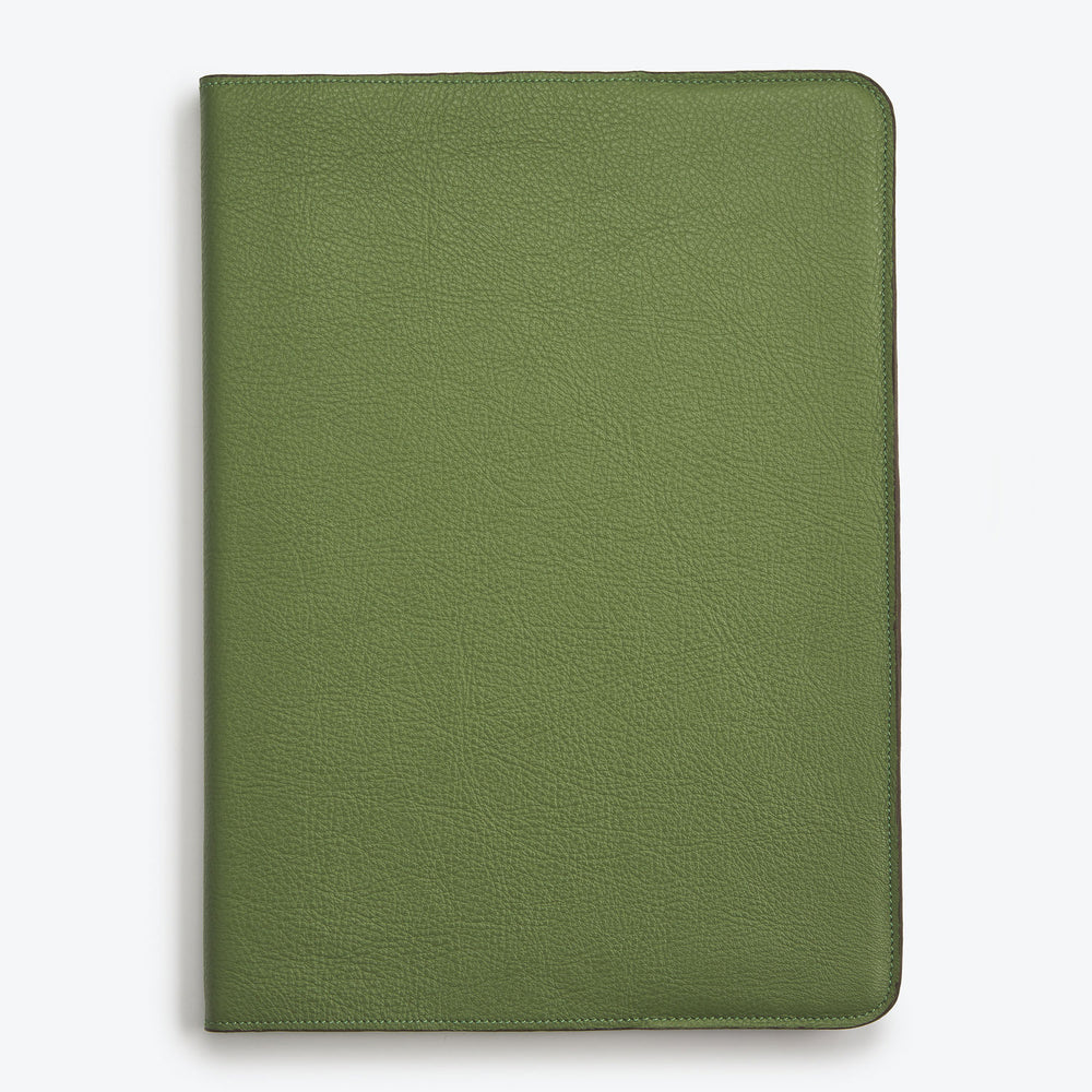 A green Luxury leather notepad with a hardcover.