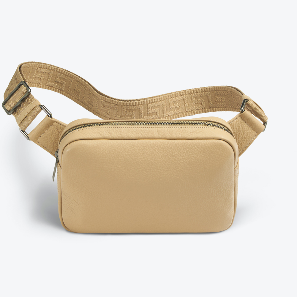 Luxury crossbody bag with a strap on a white background