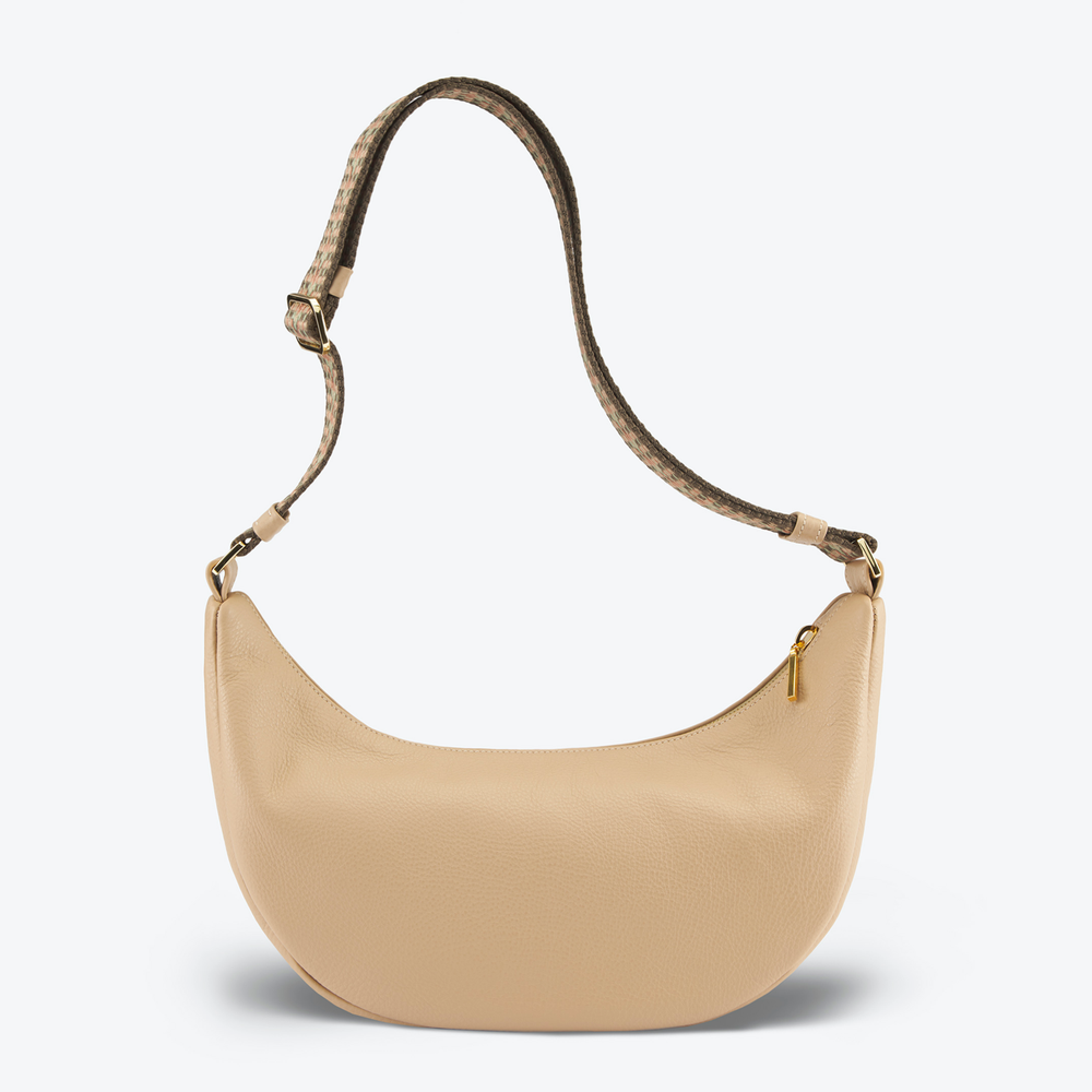 Luxury crossbody bag handbag Cream with a brown strap on a light gray 