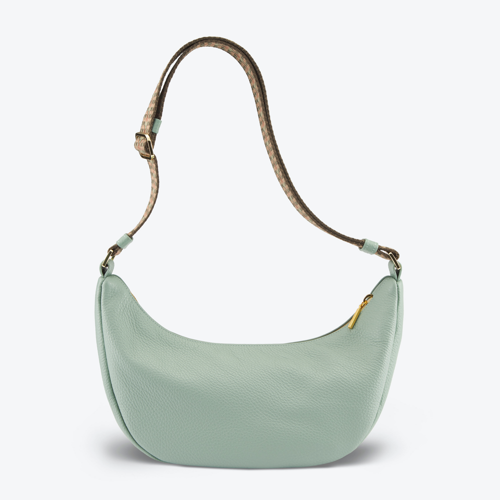 Luxury crossbody bag handbag Mint with a brown strap on a light gray 