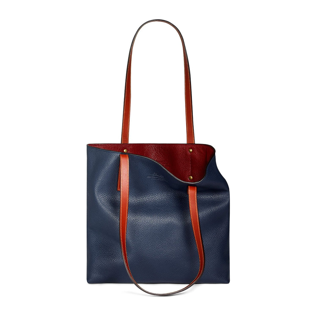 navy-and-burgundy leather tote bag